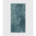 A rectangular teal blue textured porcelain wall tile with a mottled stone like surface from Komodo Porcelain Ocean