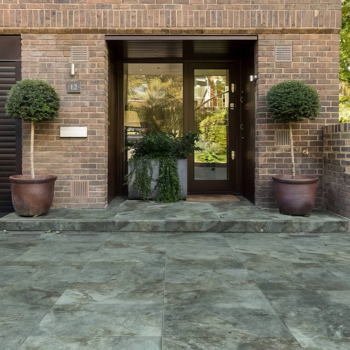 Komodo Porcelain Paving Textured Green blue and brown marble-effect paving