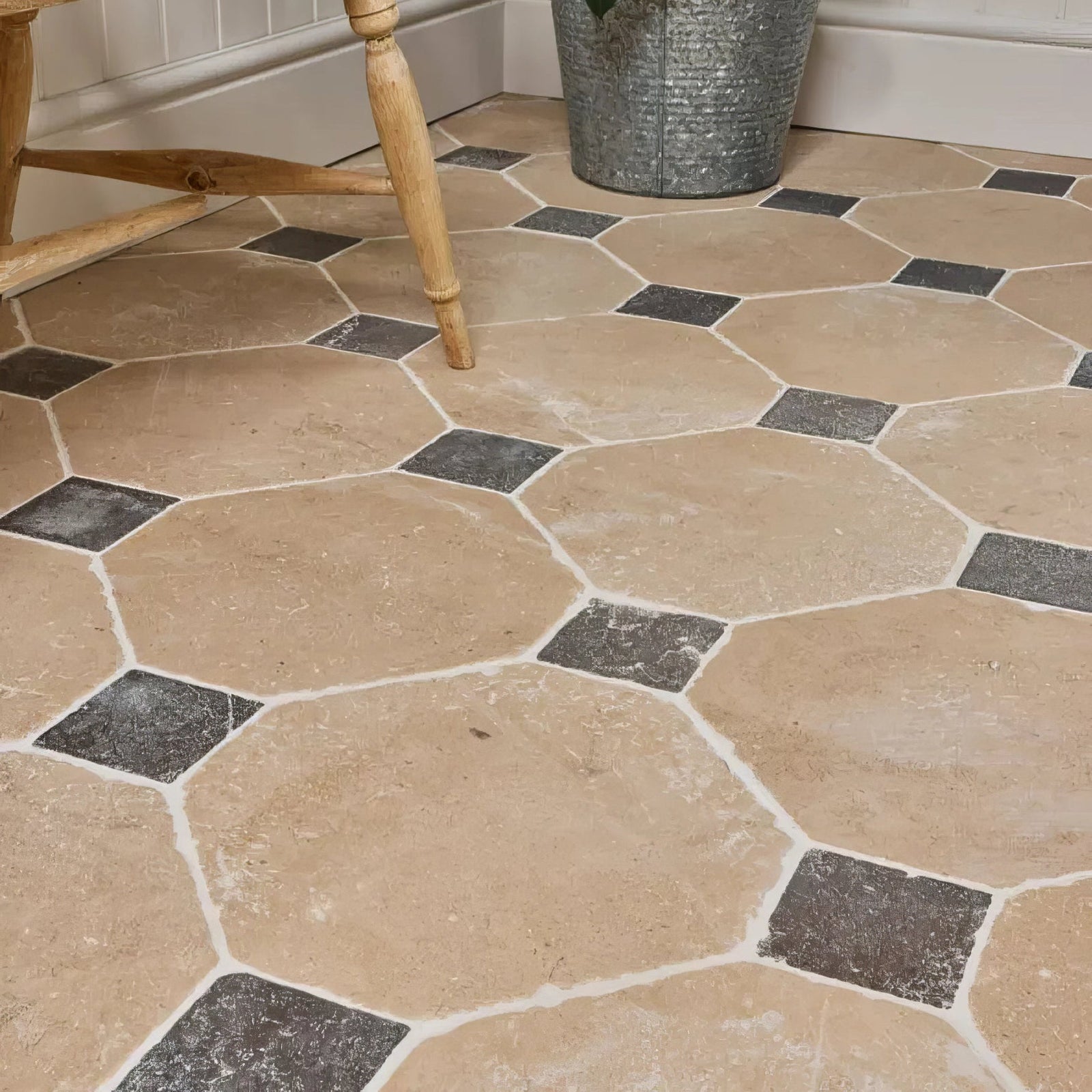 Beige and dark gray hexagonal limestone tiles with white grout in lacock limestone heritage finish octagon and cabochons pattern