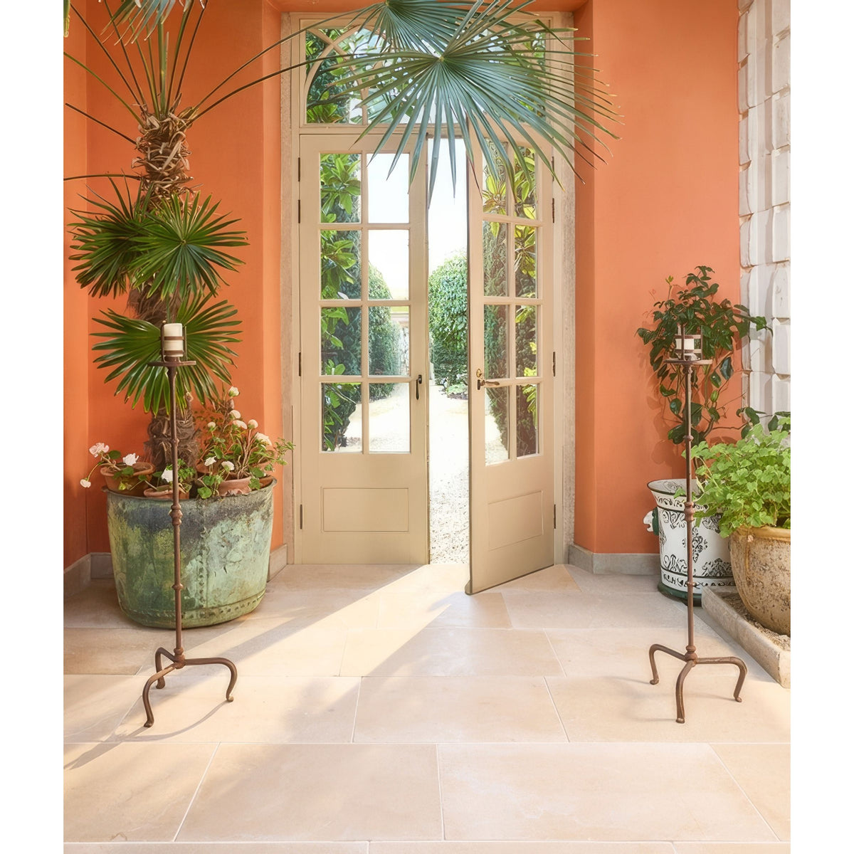 Lacock Limestone Tumbled Finish beige limestone flooring styled with antique bronze candle holders and white pillar candles
