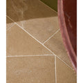 Beige lacock limestone tumbled finish stone tiles with subtle natural veining and light-colored grout lines