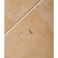 Lacock Limestone Tumbled Finish beige limestone tile with a tumbled finish and subtle textured surface showing a visible grout line
