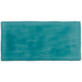 Rectangular ceramic lagoon brick tile with a smooth glazed surface and uneven turquoise color gradient