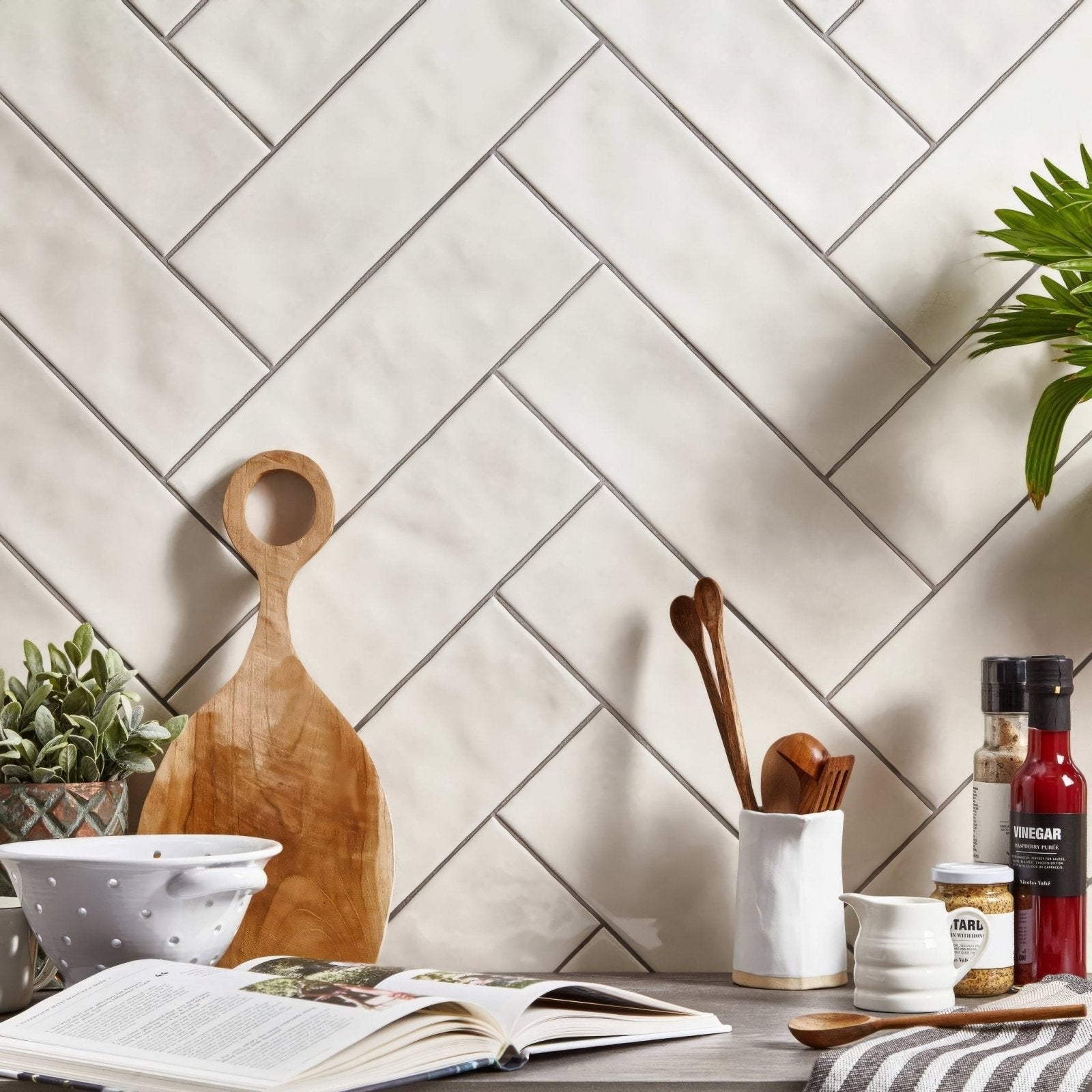 Wooden cutting board with circular handle in beige landscape dawn tile design for kitchen use