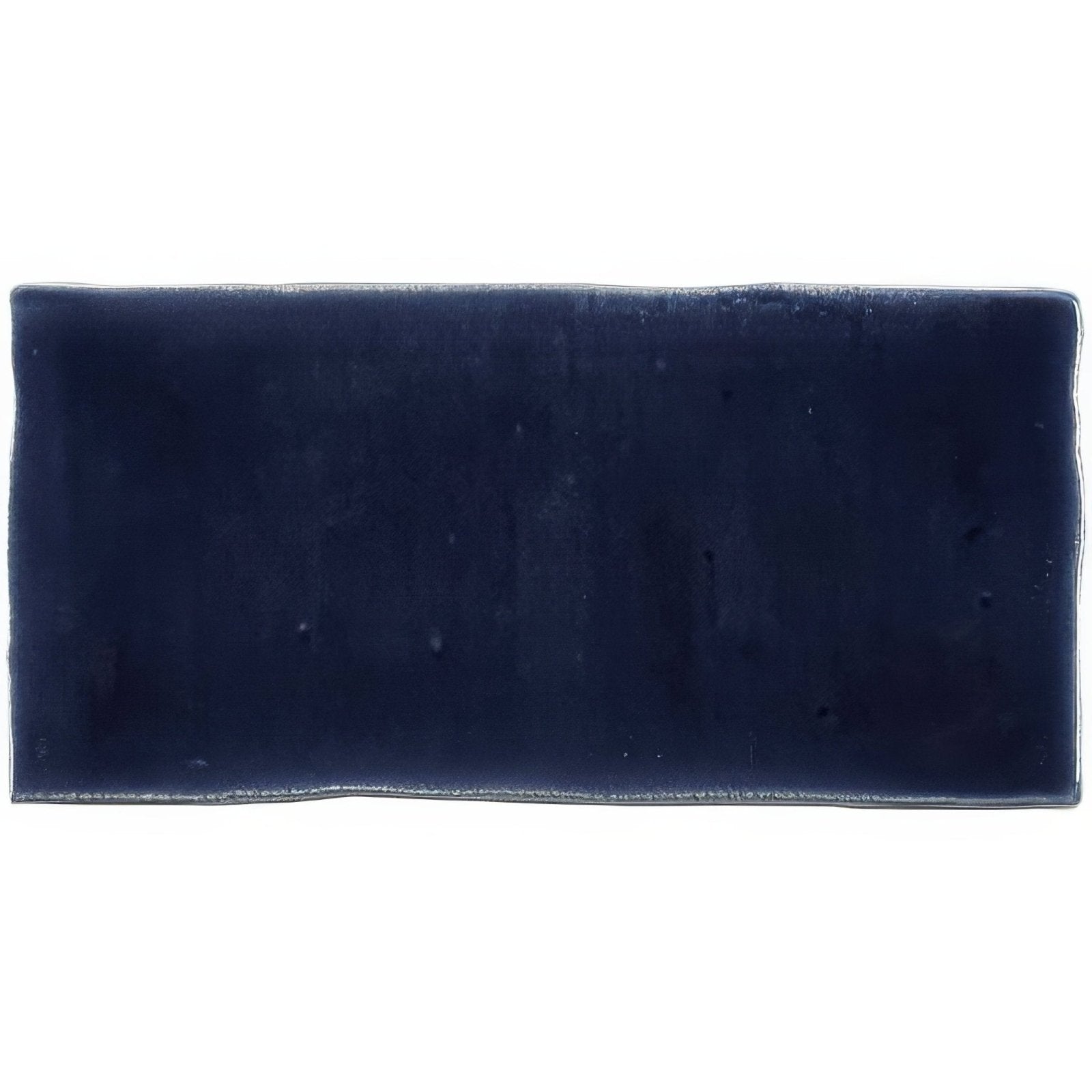 Deep navy blue rectangular ceramic lapis half tile wall tile with slightly uneven textured edges