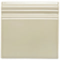 Cream-colored square ceramic lavenham artisan skirting tile with three horizontal ridges along the top edge