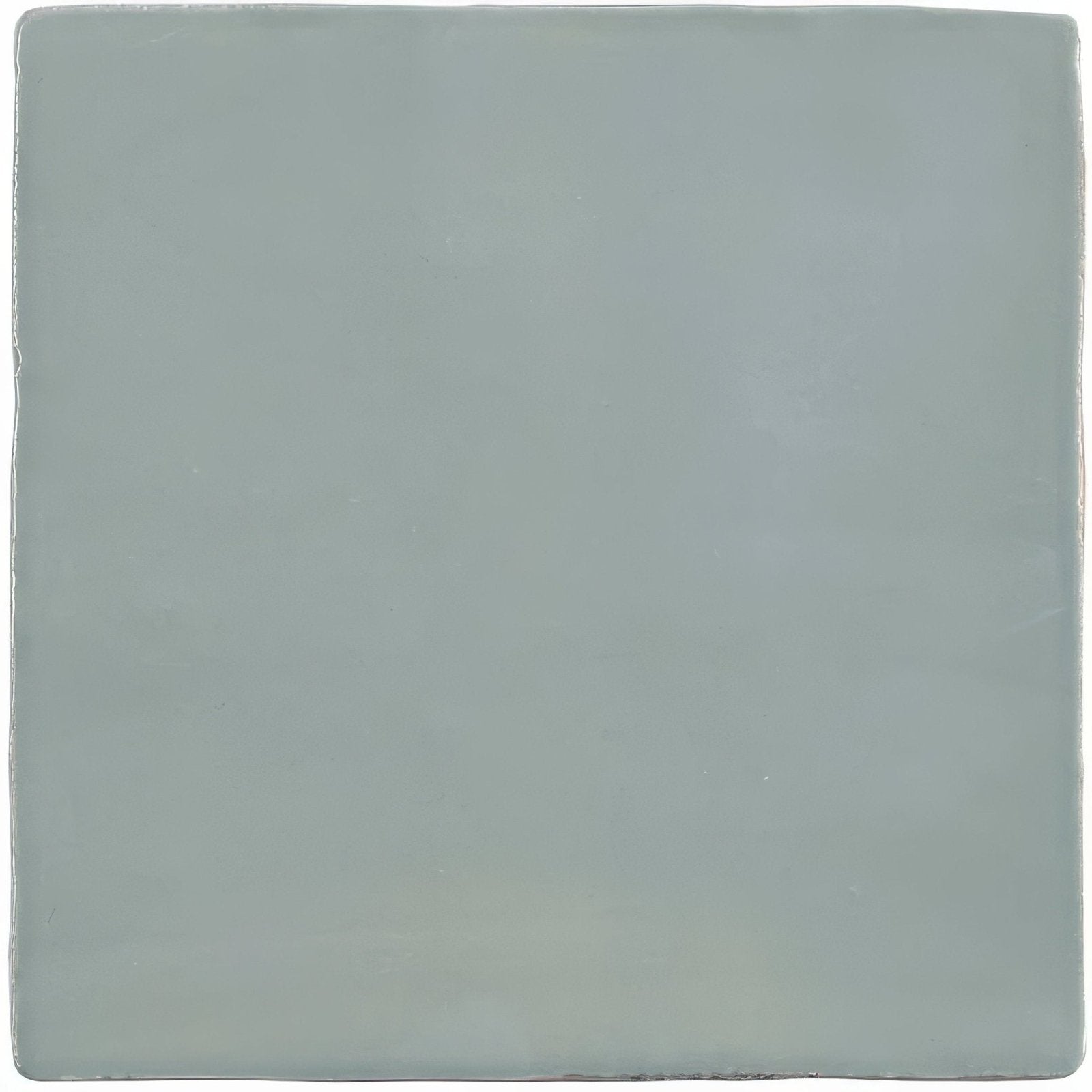 A smooth square ceramic tile with a matte sage green finish from the lazul field tile collection