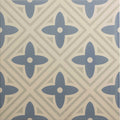 Leigh blue on chalk ceramic tile with blue and beige quatrefoil pattern and repeating design
