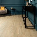 Lenke taupe wood effect tiles featuring light oak-colored wood-look laminate flooring with natural grain pattern