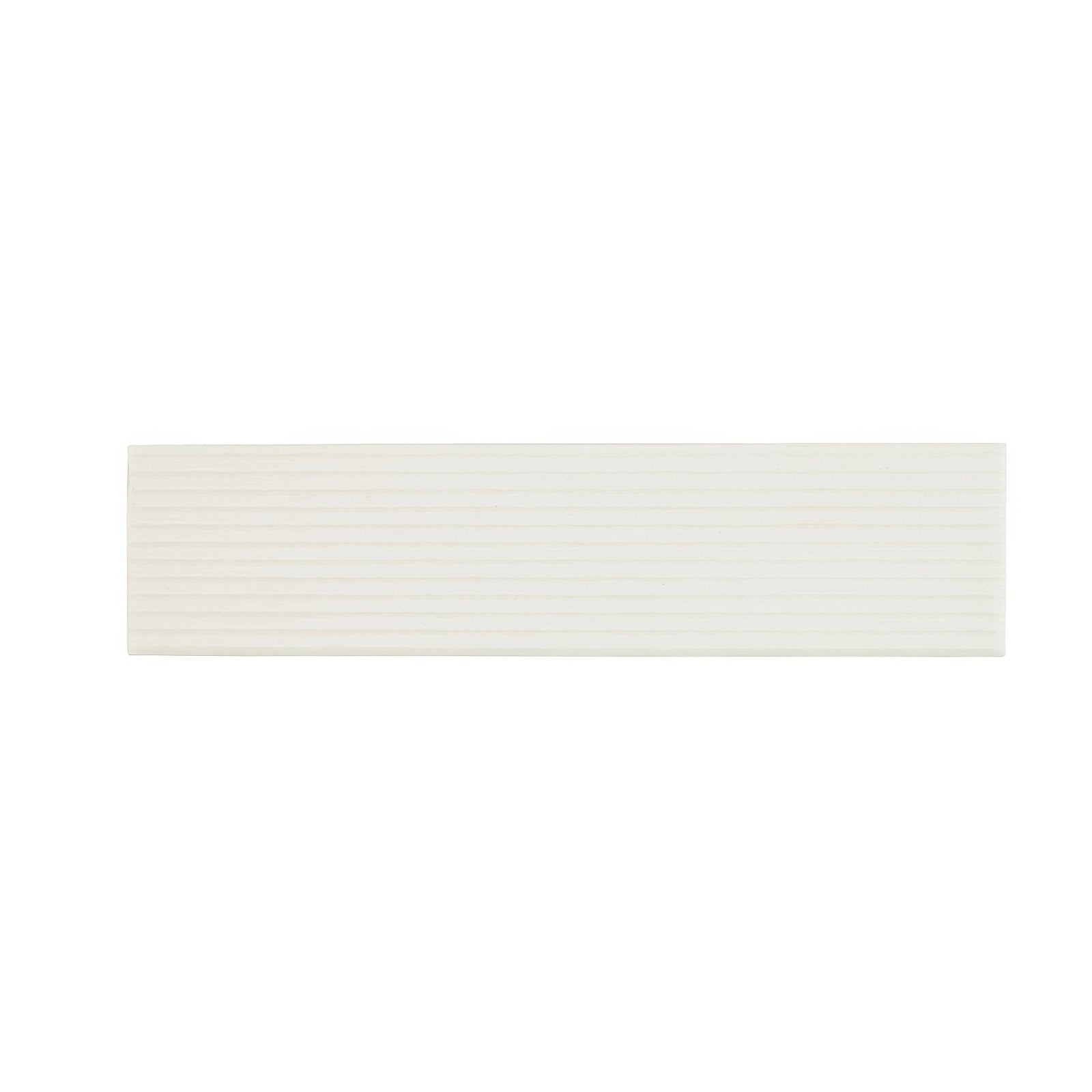 A sleek rectangular white ceramic tile with subtle horizontal ridges called Levante Ridge Chalk