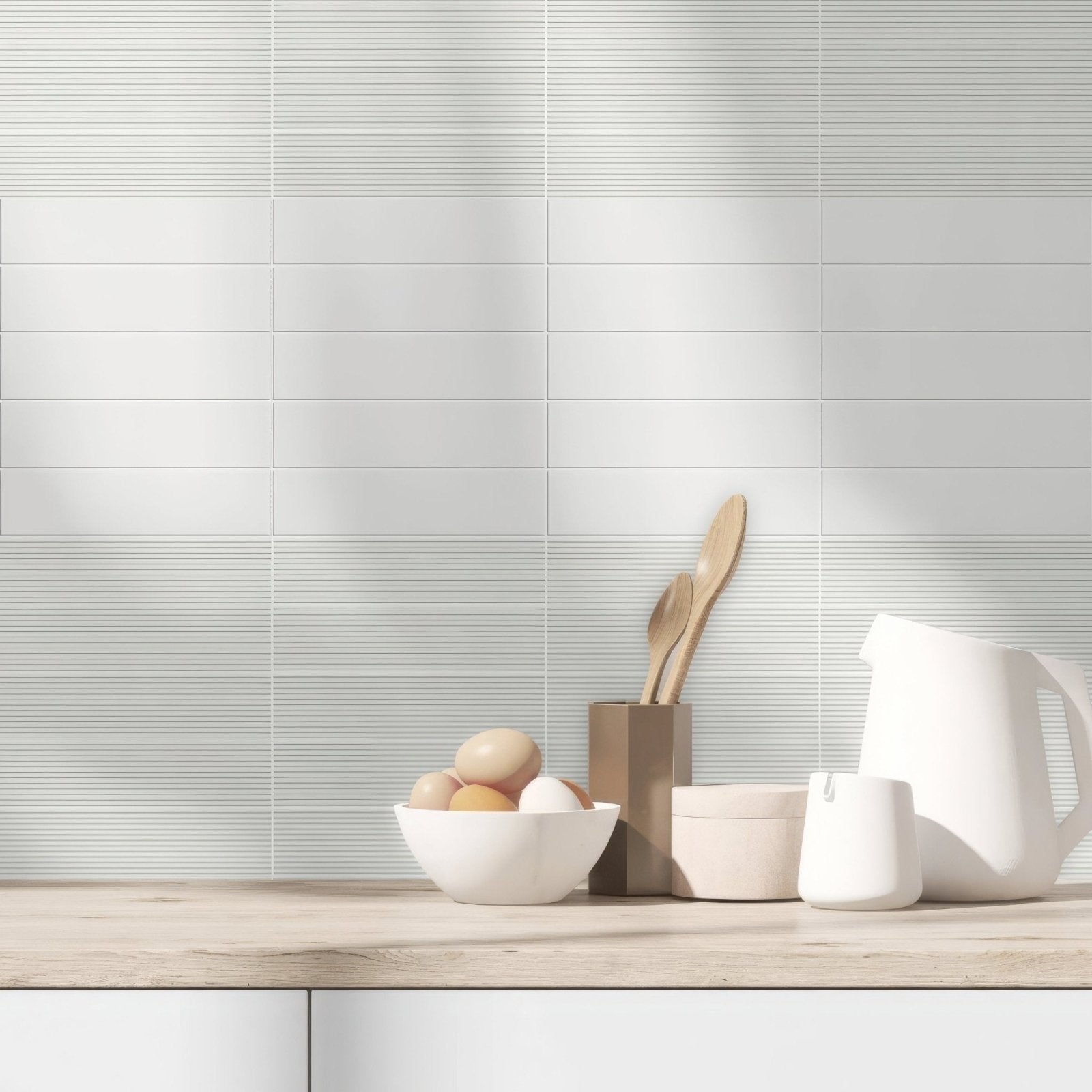 White rectangular ceramic tiles with subtle horizontal ridges for a modern kitchen backsplash levante ridge chalk