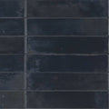 Dark blue rectangular ceramic tiles with a matte textured finish arranged in a grid pattern from lisbon blue cobalt shine collection