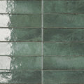 Green ceramic subway tiles with a speckled glossy finish in Lisbon green jade shine color