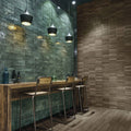 Modern black pendant lights with sleek conical shades hang above a wooden bar in lisbon green jade shine style