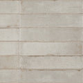 Beige rectangular ceramic tiles with subtle speckled texture and faintly weathered edges in Lisbon oyster shine finish