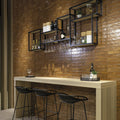 Black metal floating shelves with glassware and bottles displayed featuring lisbon terracotta shine finish