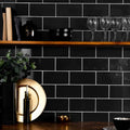 Liso black gloss gold circular plate with smooth reflective surface and subtle concentric ridges 100x200