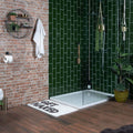 White bath mat with black get naked text featuring liso verde gloss 100x200 design