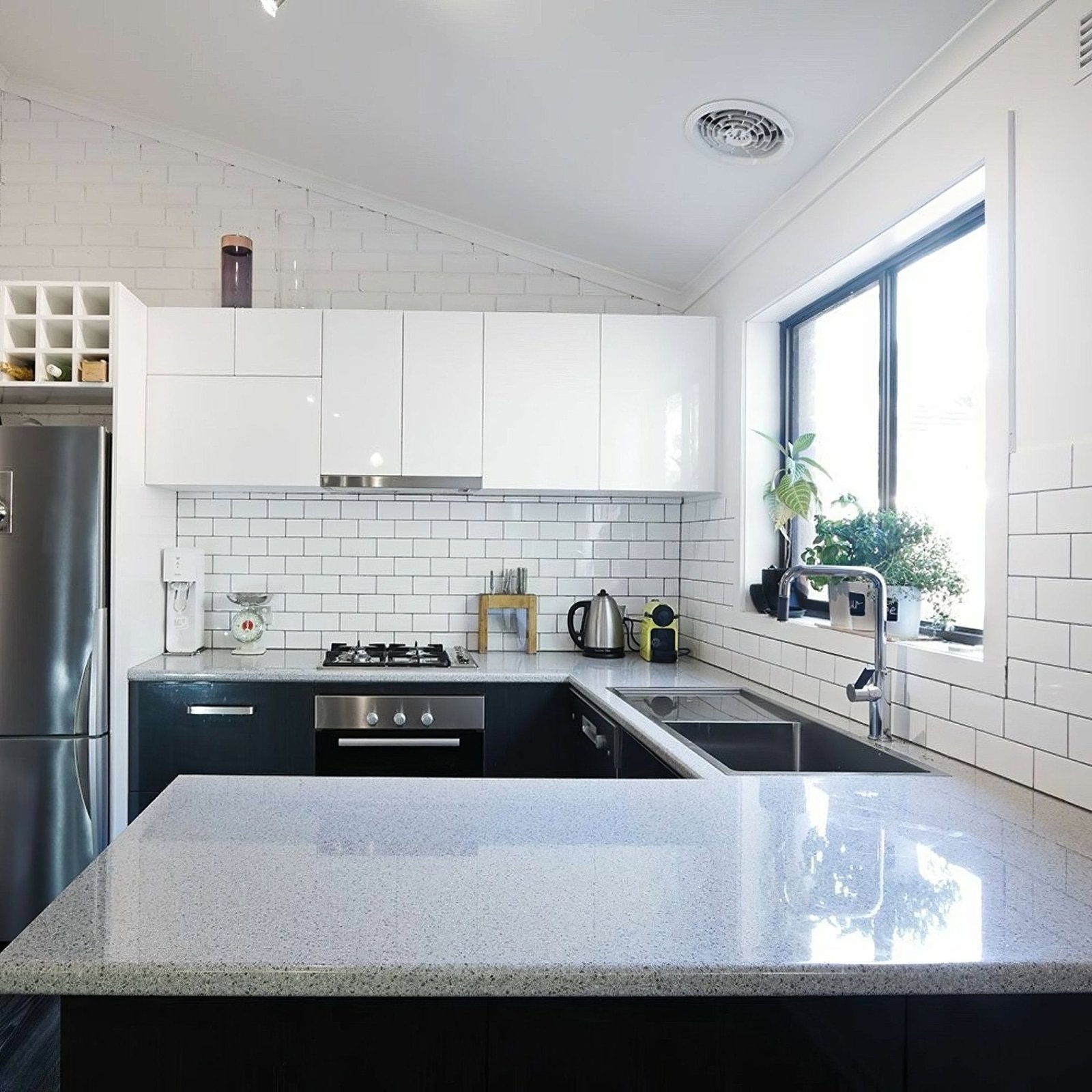 The liso white gloss 100x200 kitchen island features a sleek speckled gray granite countertop with a polished finish