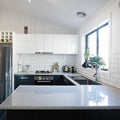 The liso white gloss 100x200 kitchen island features a sleek speckled gray granite countertop with a polished finish