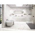 Loira 1856 White Matt white marble-effect tiles with a freestanding bathtub