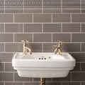 White ceramic wall-mounted sink with gold-finished faucets from london stone albert moulding collection