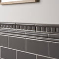 Gray ceramic london stone dentil moulding tile border with decorative raised rectangular pattern