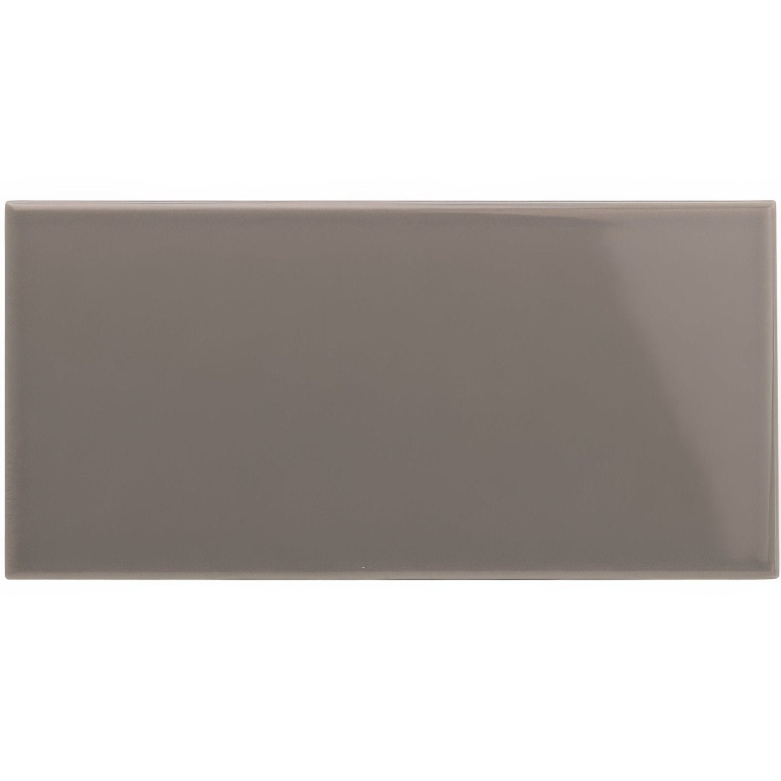 A sleek glossy taupe rectangular london stone half tile with smooth edges and a uniform matte finish