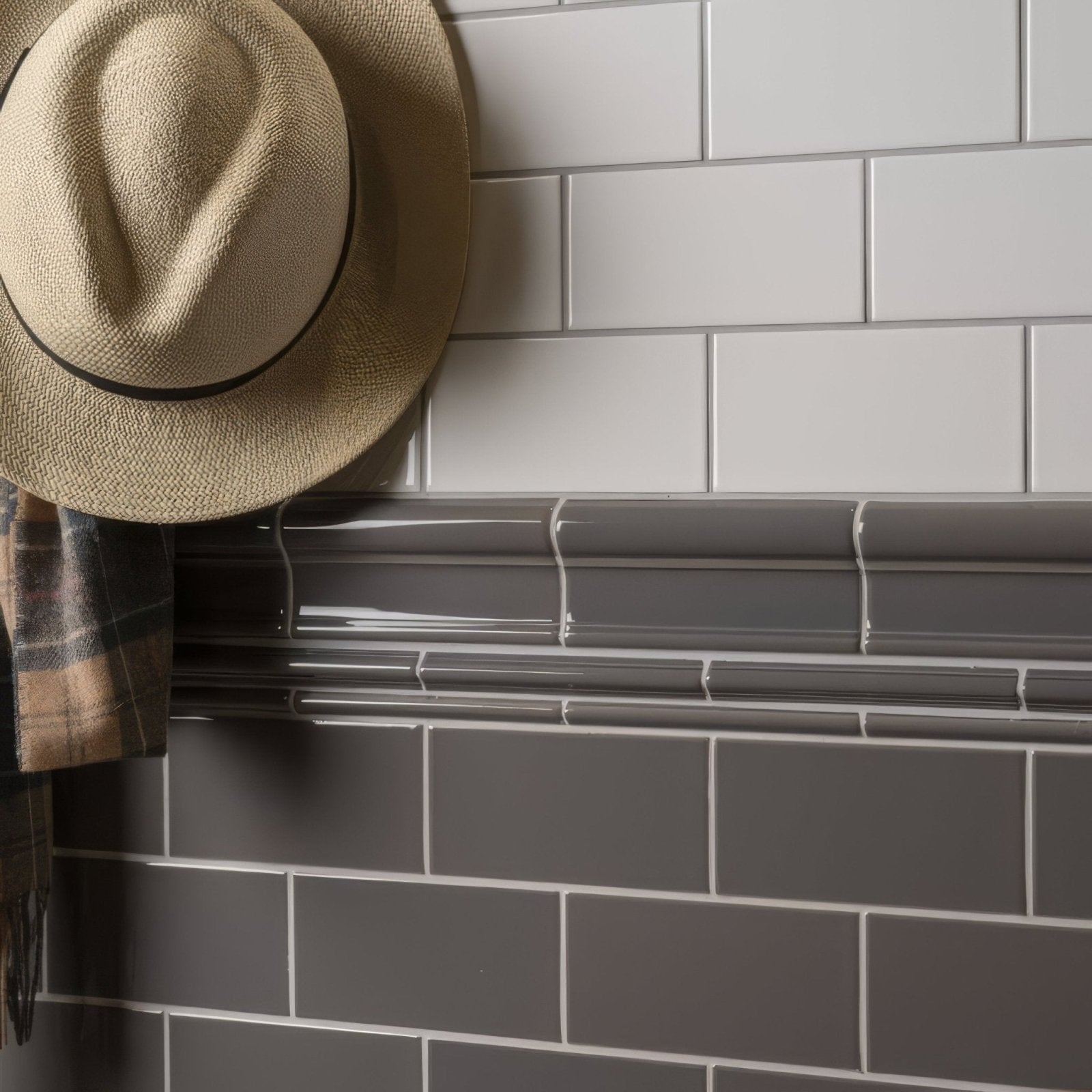 A beige woven straw fedora hat with a dark brown band featured alongside London Stone half tile design