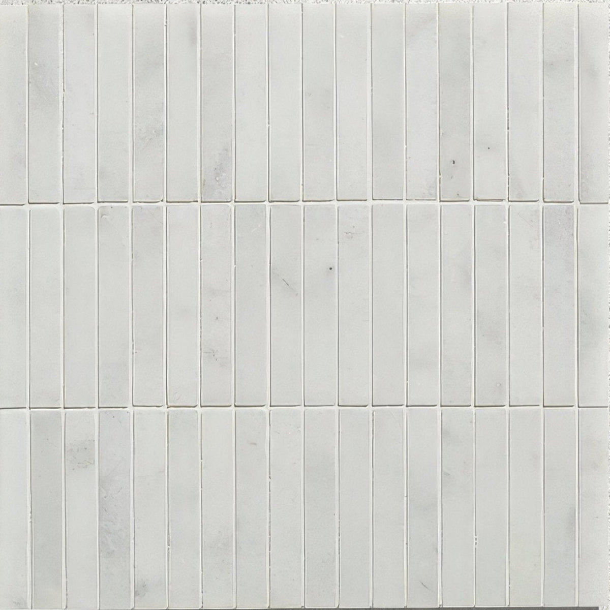 Long island marble bamboo mosaic featuring white marble subway tile with subtle gray veining in a mosaic pattern