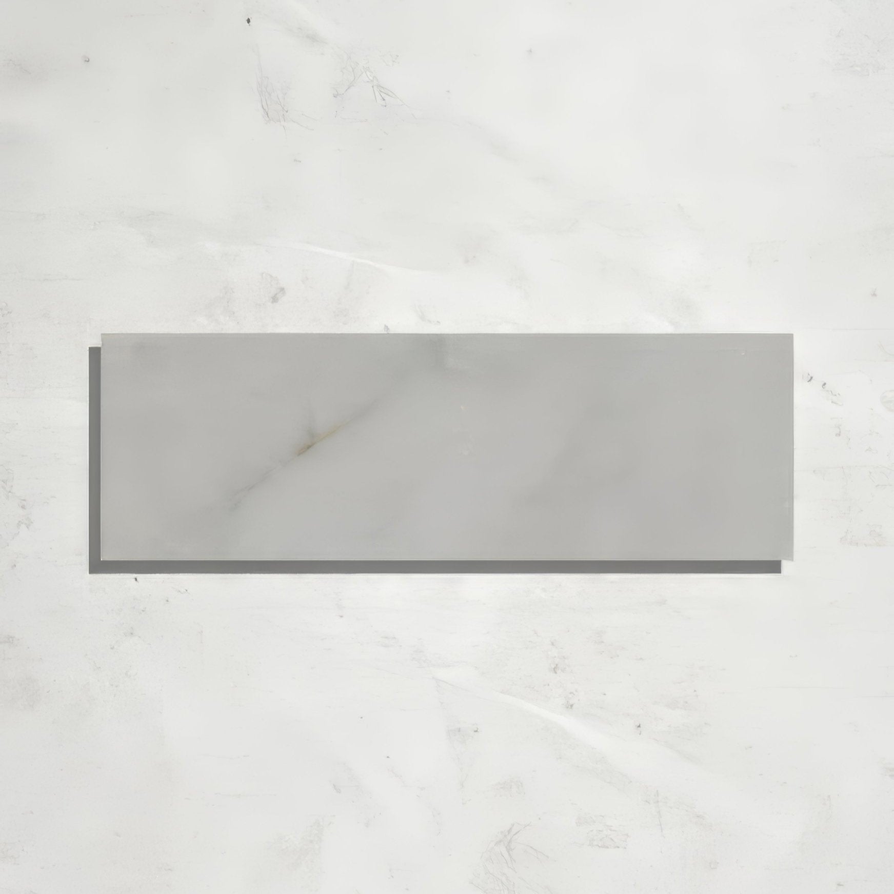 Gray rectangular long island marble brick tile with honed finish and subtle white veining resembling marble