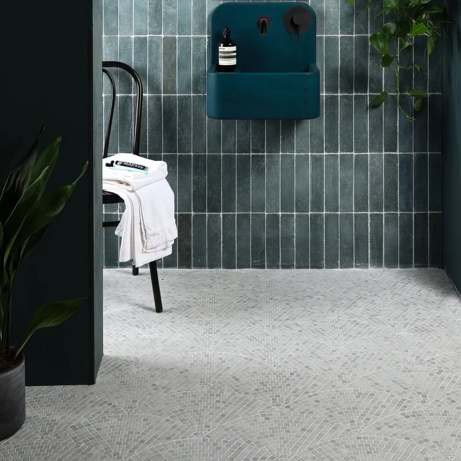 Long Island Marble Fan Mosaic grey marble fan mosaic with a teal wall-mounted sink