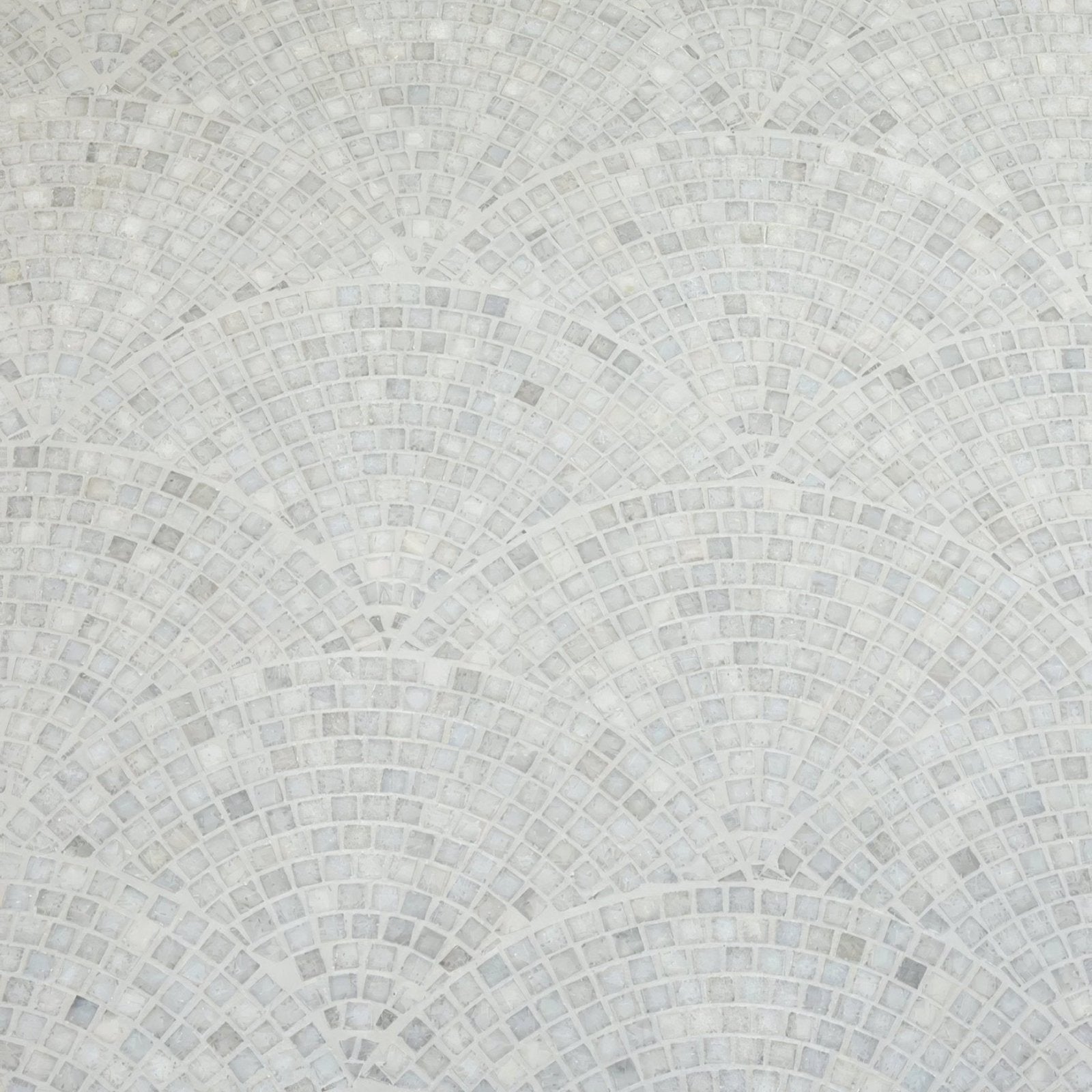 White marble mosaic tile with subtle veining arranged in concentric fan-shaped rows long island marble fan mosaic