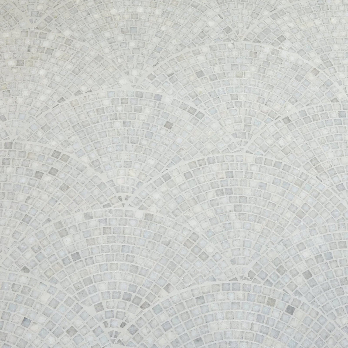 White marble mosaic tile with subtle veining arranged in concentric fan-shaped rows long island marble fan mosaic