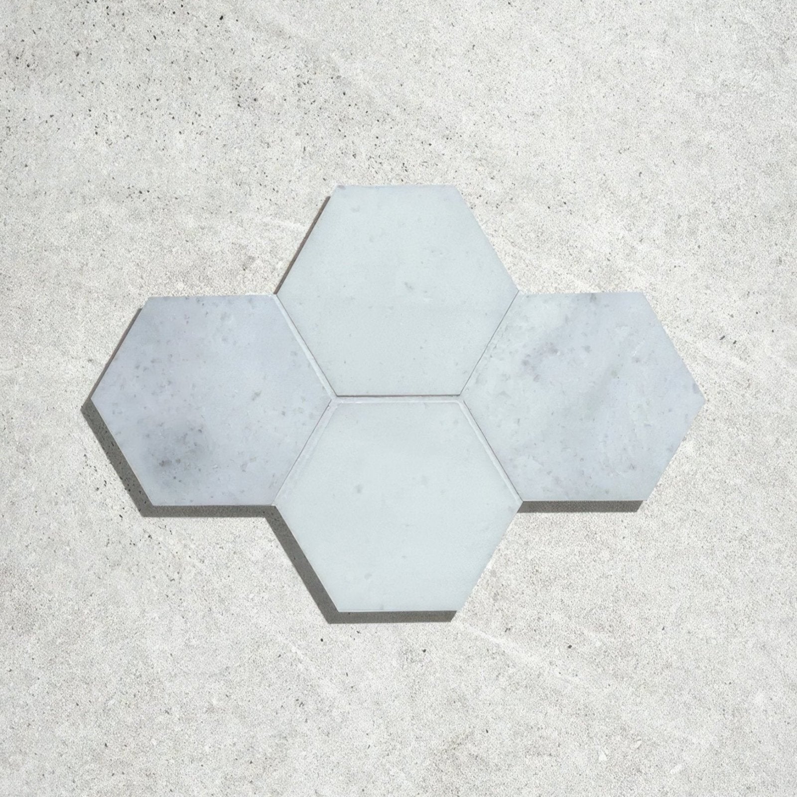 Long island marble large hexagon mosaic featuring light gray hexagonal marble tiles arranged in a star-like pattern