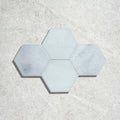 Long island marble large hexagon mosaic featuring light gray hexagonal marble tiles arranged in a star-like pattern