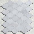Long island marble teardrop mosaic tiles with light gray wavy-edged marble in a repeating pattern