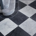 Long island marble tumbled finish black and white marble tiles arranged in a diamond pattern 40.6 x 40.6cm