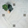 White marble long island tumbled finish tiles 61 x 61cm with subtle gray veining and gray mosaic diamond insets