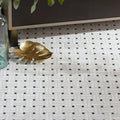 Long Island Marble Wicker Mosaic white and black woven marble mosaic floor with a gold leaf-shaped tray