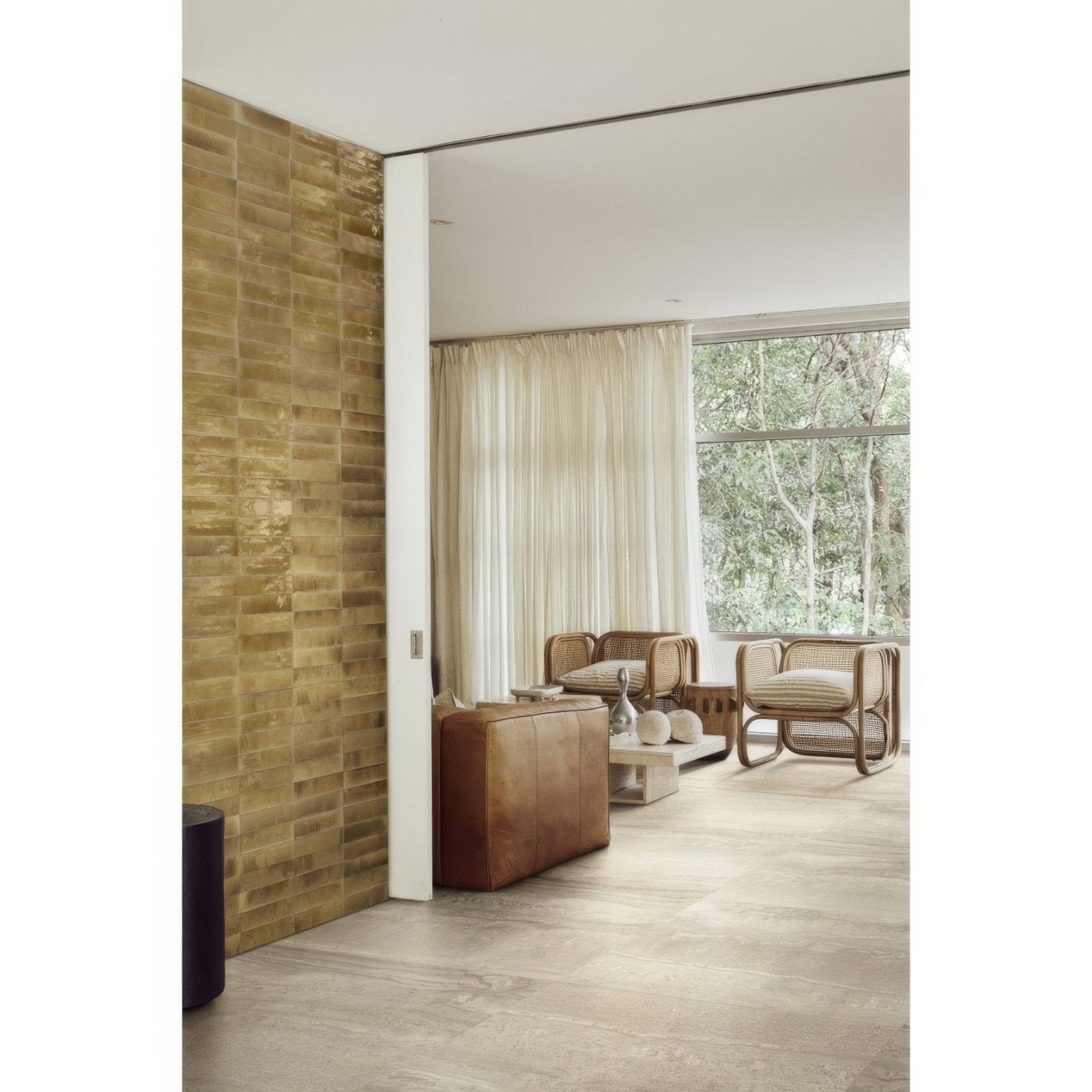 Brown leather ottoman with smooth slightly worn texture and soft rounded edges from luminous lume beige collection