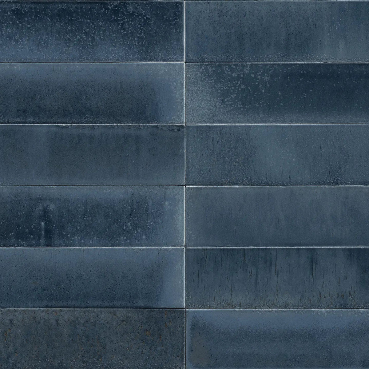 Dark gray rectangular matte textured tiles from luminous lume blu china arranged in a grid pattern