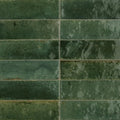 Dark green rectangular ceramic tiles luminous lume green with matte slightly textured surface and subtle tone variations