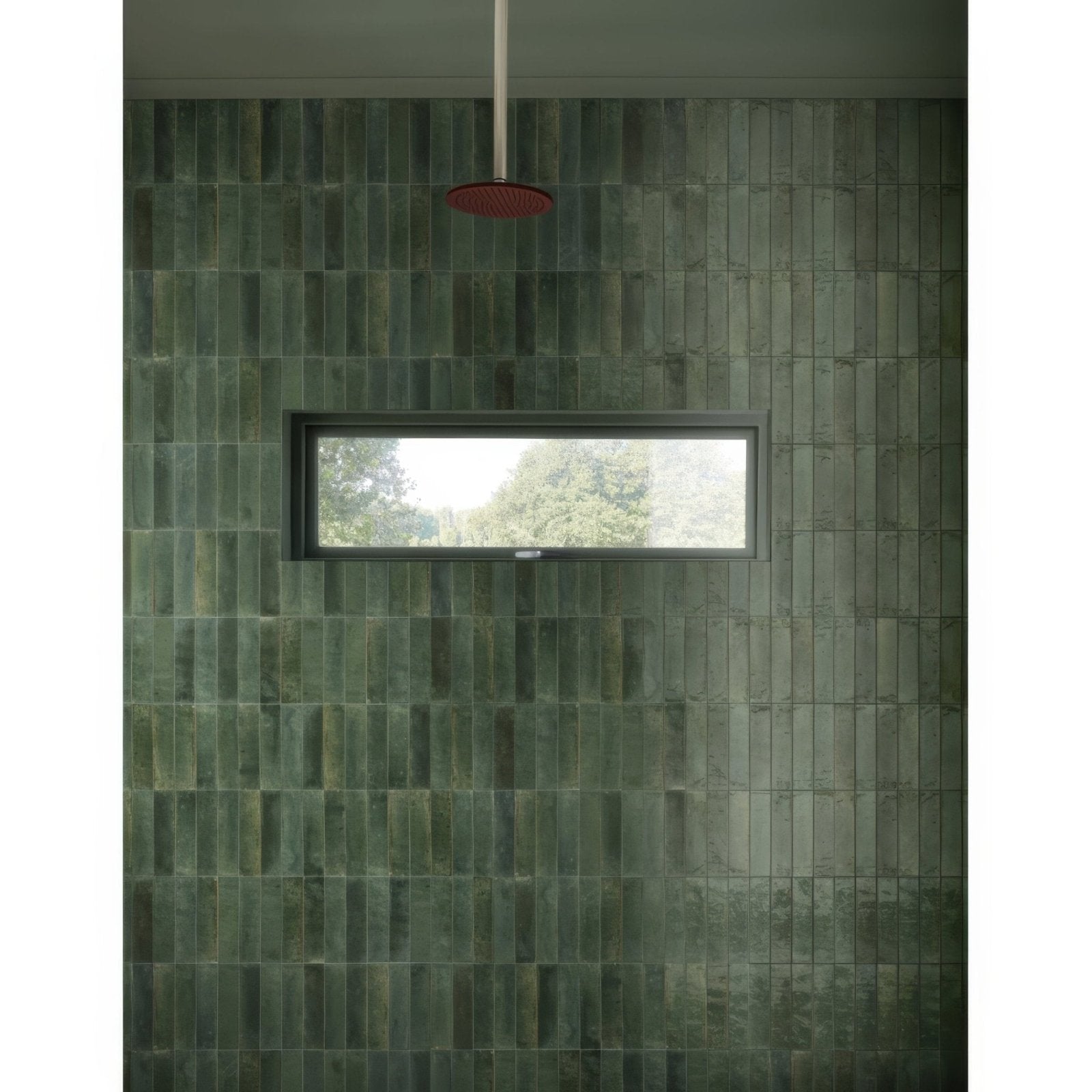 Dark green rectangular ceramic tiles with a matte finish cover the shower wall luminous lume green product