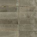 Gray rectangular luminous lume greige tiles with textured weathered finish ideal for modern flooring or walls