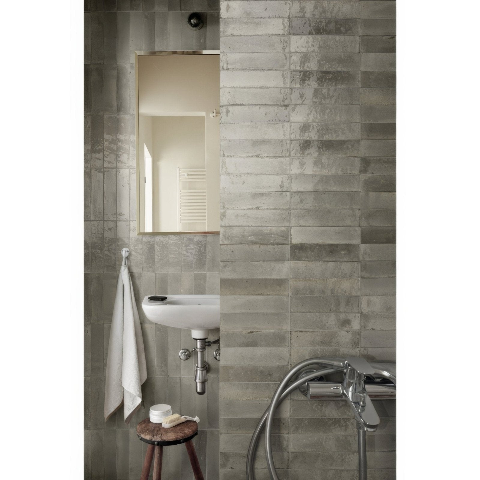Gray concrete effect rectangular wall tiles with subtle texture and horizontal alignment luminous lume greige