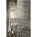 Gray concrete effect rectangular wall tiles with subtle texture and horizontal alignment luminous lume greige