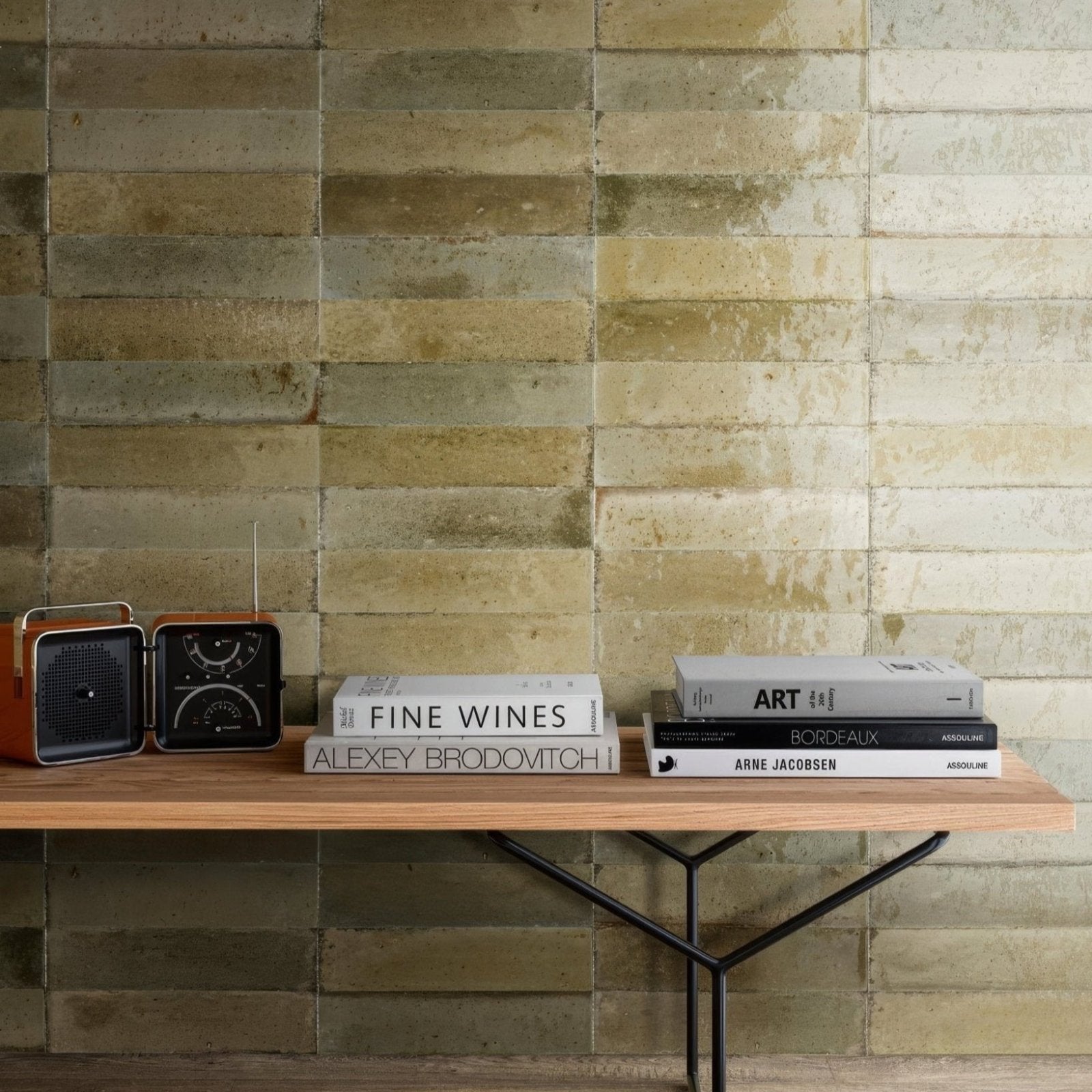 Luminous Lume Musk vintage-style wooden and black radio with a circular dial on a minimalist shelf beside books