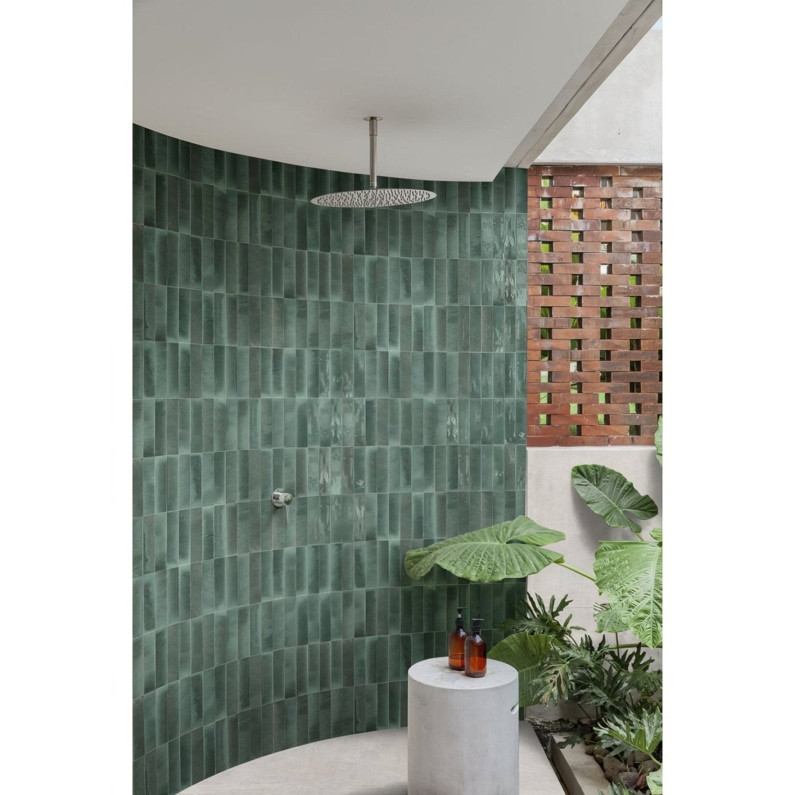 Luminous Lume Turquoise rain showerhead with sleek circular chrome design and intricate mesh pattern