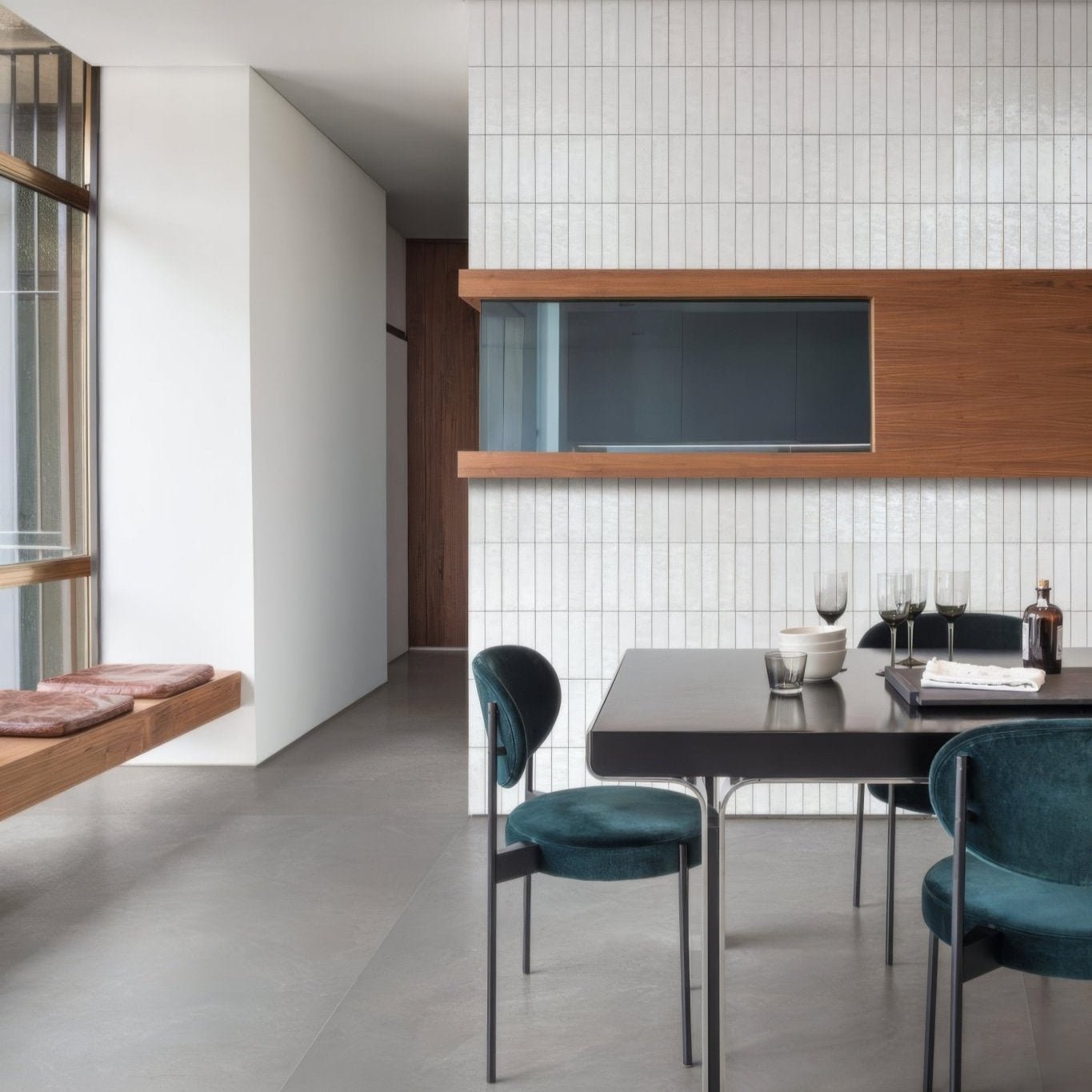 Teal velvet dining chairs with slender metal frames featured in luminous lume white collection
